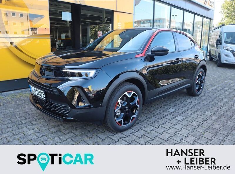 Grün metallic Gebraucht 2023 Opel Mokka-e Ultimate SUV | 24.960 € (Teuer) - Bild 1/4