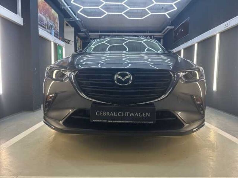 Machine gray (metallic) Gebraucht 2020 Mazda CX-3 SUV | 17.980 € (Fairer Preis) - Bild 1/4