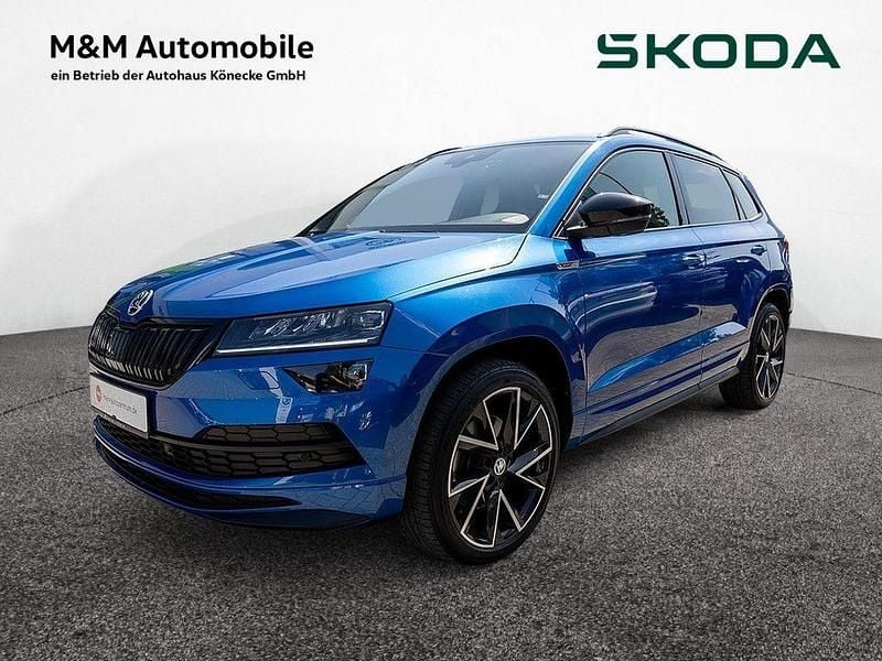 Raceblau Gebraucht 2020 Skoda Karoq SportLine SUV | 29.460 € (Teuer) - Bild 1/4