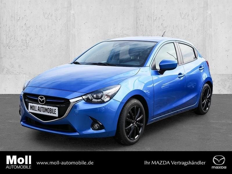 Dynamic blue Gebraucht 2016 Mazda 2 Sports-Line Kleinwagen | 10.890 € (Fairer Preis) - Bild 1/4