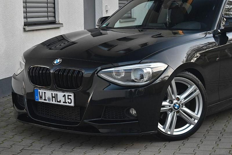 Saphirschwarz Gebraucht 2012 BMW 118 Performance Kleinwagen | 10.991 € (Teuer) - Bild 1/4