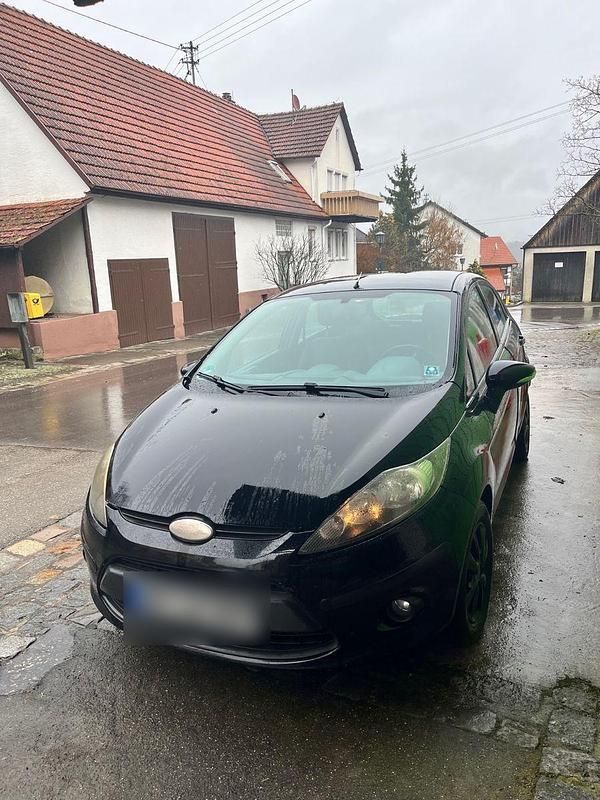 Gebraucht Ford Fiesta Ambiente 82 PS (60 kW) 2010 Schwarz Kleinwagen