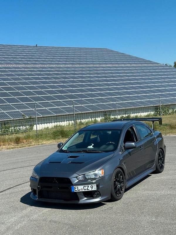 Grau Gebraucht 2010 Mitsubishi Lancer Limousine | 34.999 € - Bild 1/4
