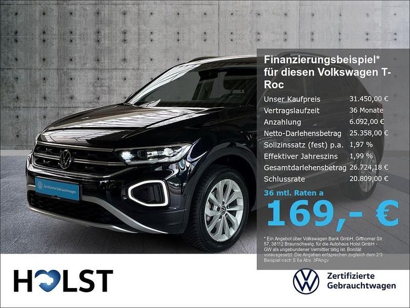 Deep black perleffekt Gebraucht 2024 VW T-Roc Style SUV | 31.450 € (Fairer Preis) - Bild 1/4