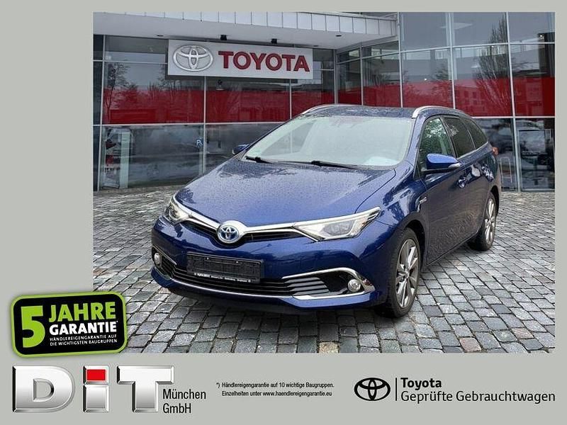 Dark blue mica (metallic) Gebraucht 2016 Toyota Auris Hybrid Executive Kombi | 16.990 € (Etwas zu teuer) - Bild 1/4