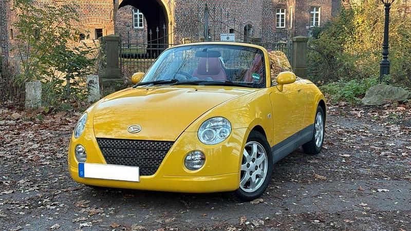 Gelb Gebraucht 2004 Daihatsu Copen Cabrio | 3.100 € - Bild 1/4