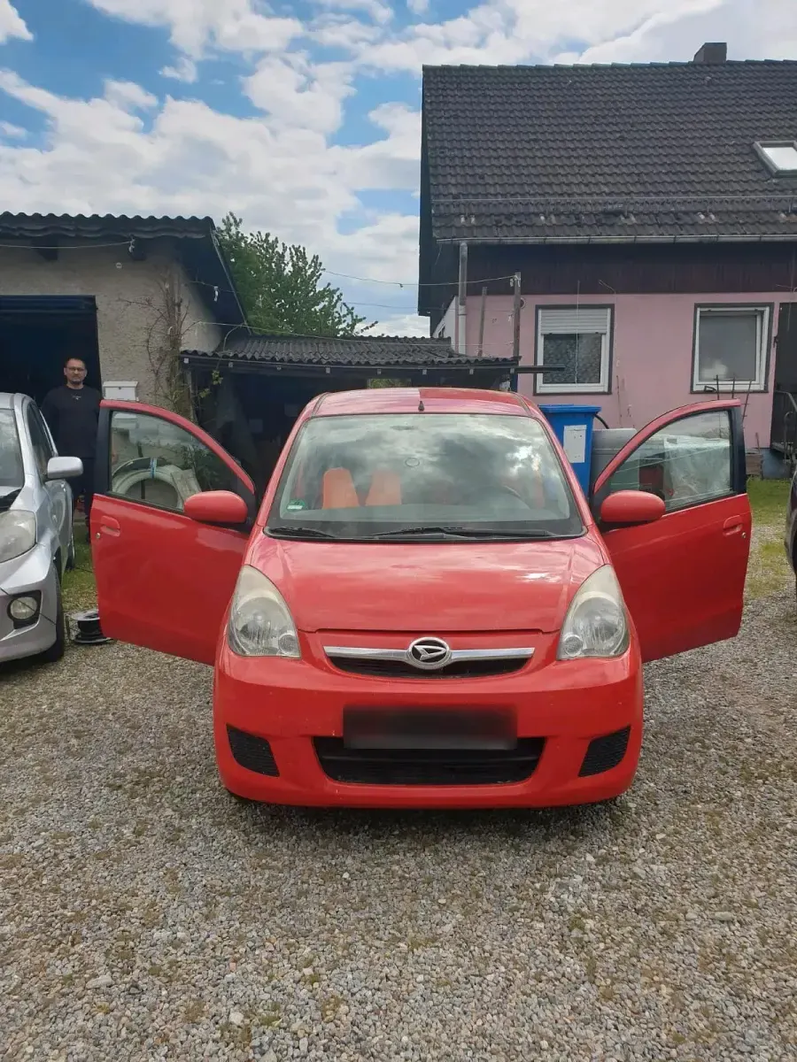 Gebraucht Daihatsu Cuore 69 PS (50 kW) 2008 Rot Kleinwagen