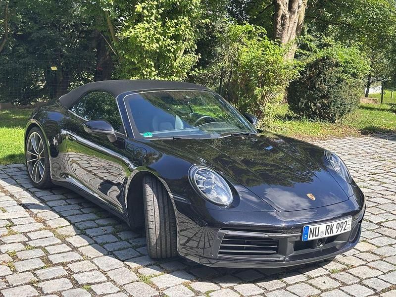 Schwarz Gebraucht 2023 Porsche 911 Carrera Cabriolet Cabrio | 132.000 € (Fairer Preis) - Bild 1/4