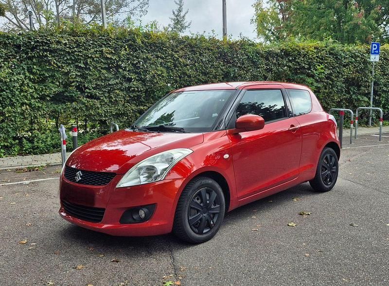 Orange Gebraucht 2011 Suzuki Swift Kleinwagen | 4.690 € (Fairer Preis) - Bild 1/4