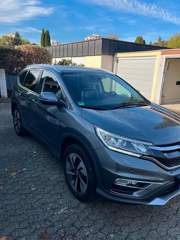 Grau Gebraucht 2017 Honda CR-V Executive SUV | 20.300 € (Etwas zu teuer) - Bild 1/4