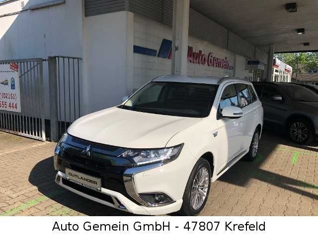 Weiß Gebraucht 2021 Mitsubishi Outlander P-HEV Basis SUV | 23.250 € (Etwas zu teuer) - Bild 1/4