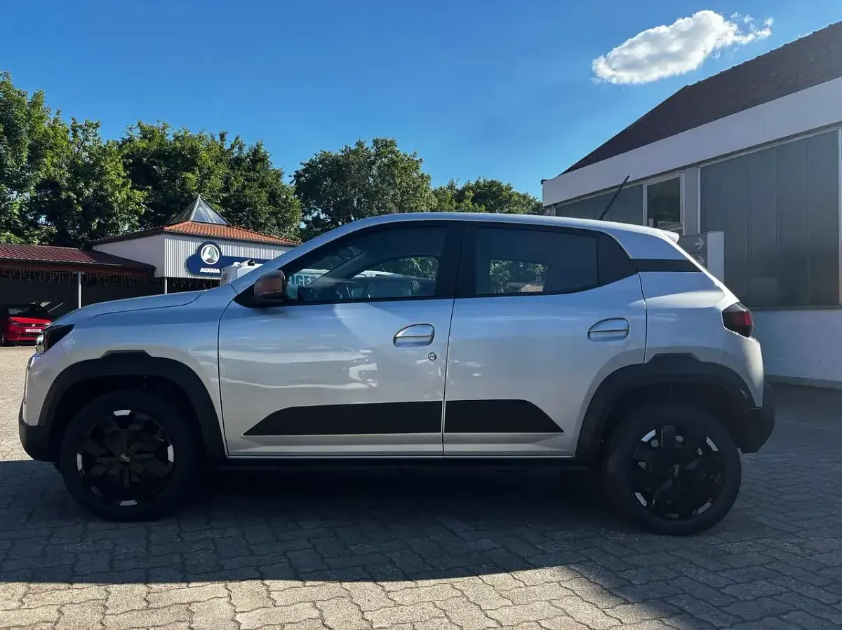 Gebraucht Dacia Spring Extreme 47 kW (65 PS) 2025 Diamantsilbergrau Kleinwagen