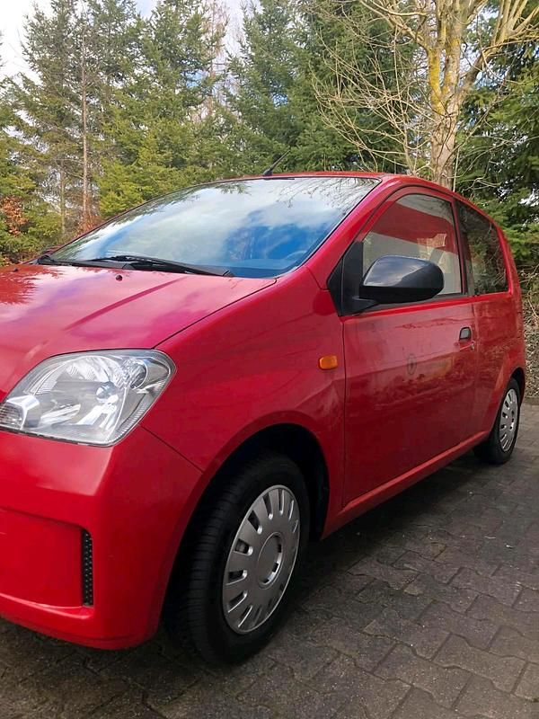Gebraucht Daihatsu Cuore 58 PS (42 kW) 2004 Rot Kleinwagen