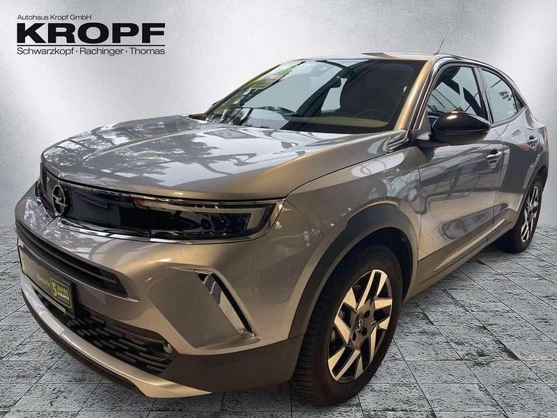 Gebraucht Opel Mokka-e Elegance 100 kW (136 PS) 2022 Kontrast grau/quarz silber SUV