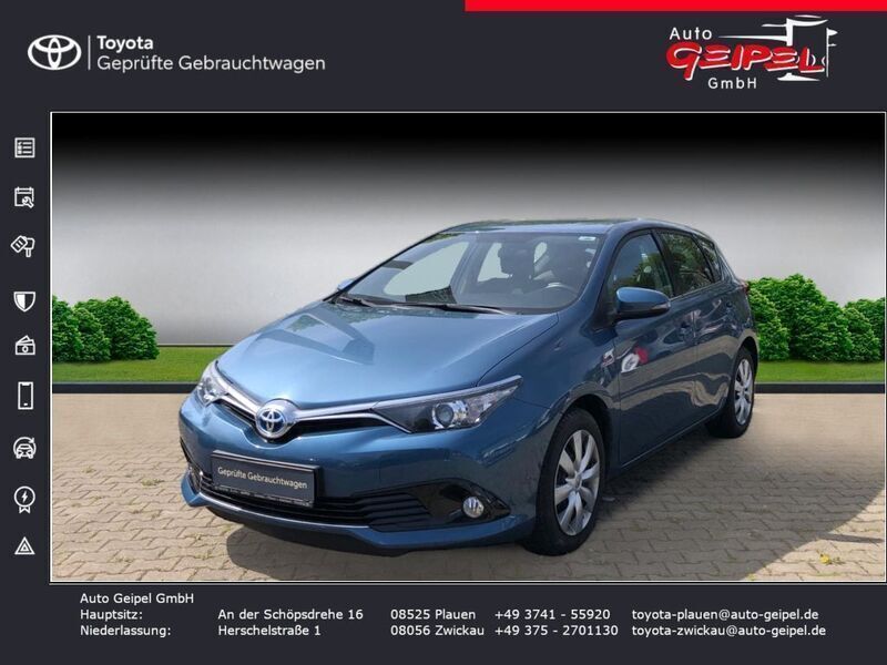Denimblau metallic Gebraucht 2016 Toyota Auris Hybrid Basis Limousine | 14.990 € (Fairer Preis) - Bild 1/4