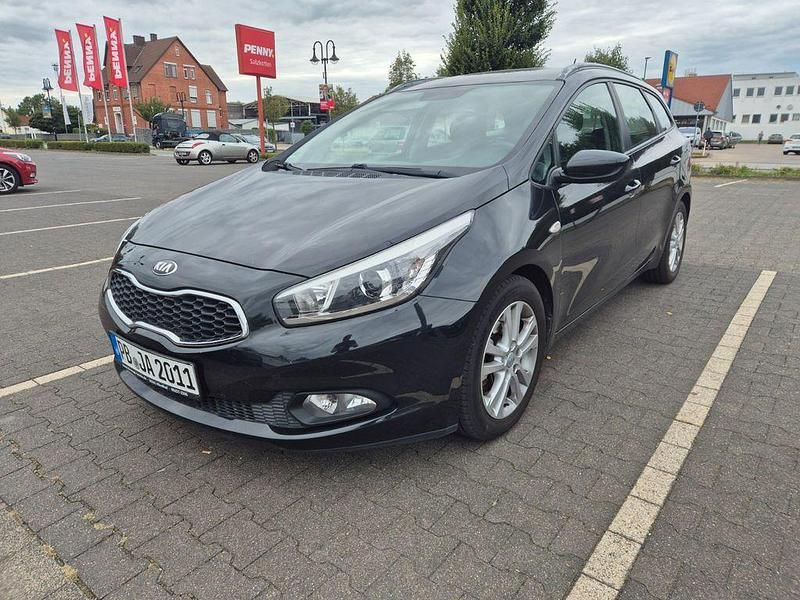 Schwarz Gebraucht 2014 Kia Ceed Sportswagon DREAM-TEAM Edition Kombi | 5.499 € (Superpreis) - Bild 1/4