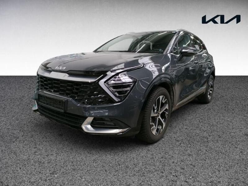 H8g) pentametal met. (grau Gebraucht 2024 Kia Sportage Spirit SUV | 31.880 € (Guter Preis) - Bild 1/4
