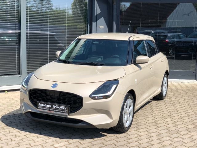 Caravan ivory pearl metallic Neu 2024 Suzuki Swift Comfort Kleinwagen | 18.900 € - Bild 1/4