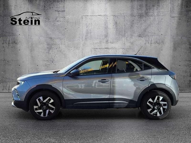 Gebraucht Opel Mokka-e Elegance 100 kW (136 PS) 2022 Kontrast grau/quarz silber (metallic) SUV