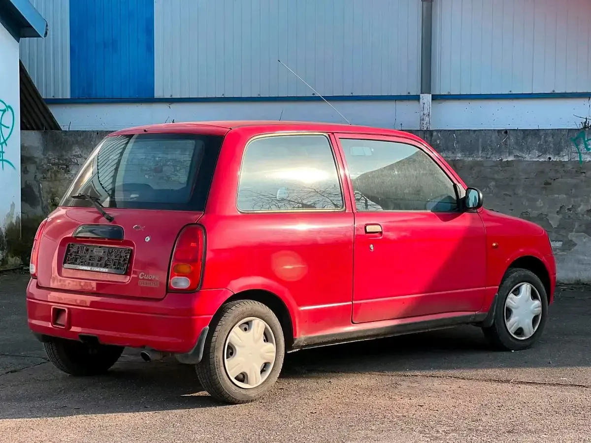 Gebraucht Daihatsu Cuore 58 PS (42 kW) 2000 Rot Kleinwagen
