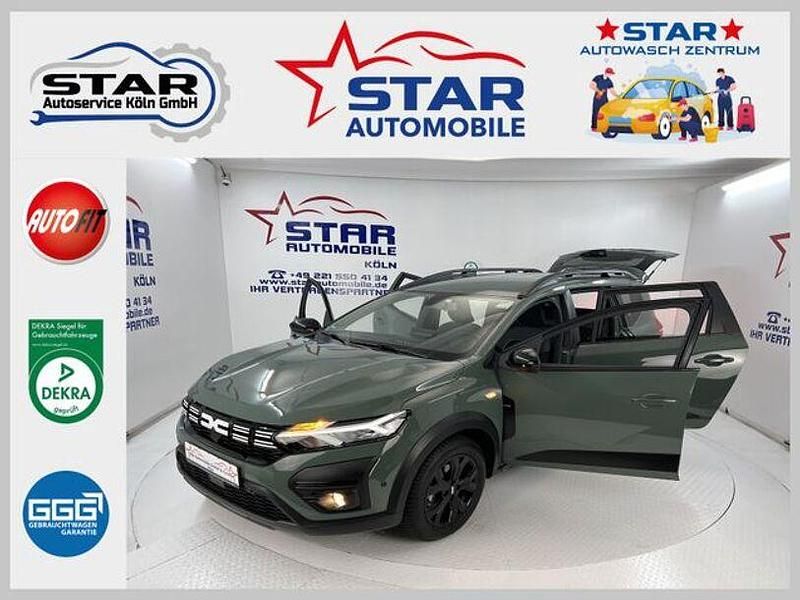 Green dusty Gebraucht 2023 Dacia Jogger Extreme Van / Kleinbus | 18.890 € (Guter Preis) - Bild 1/4