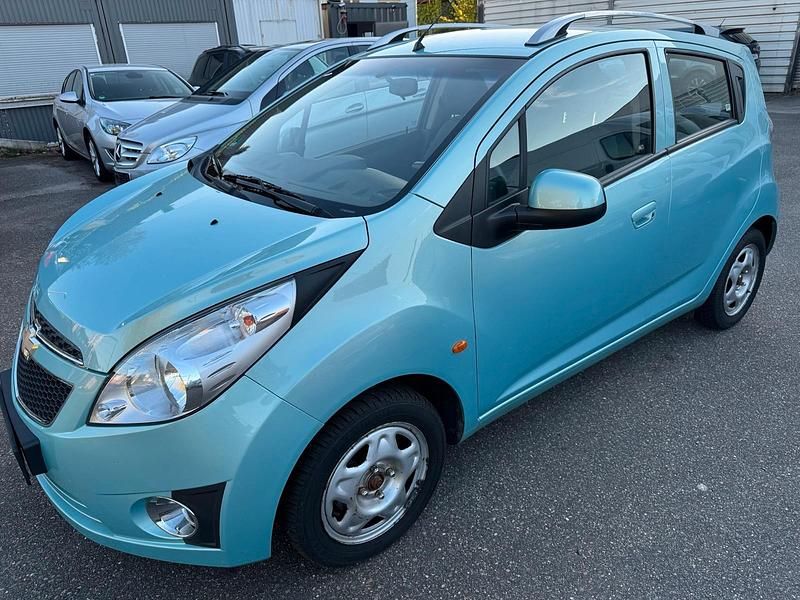 Blau Gebraucht 2012 Chevrolet Spark Kleinwagen | 3.399 € (Fairer Preis) - Bild 1/4