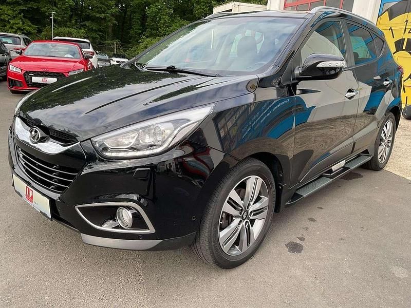 Phantom black / mic Gebraucht 2014 Hyundai Tucson Premium SUV | 14.990 € - Bild 1/4