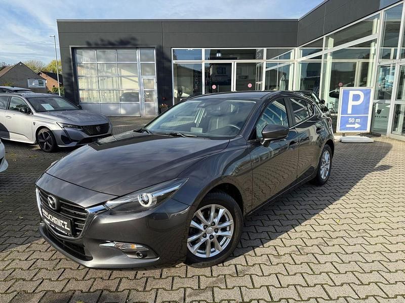 Grau Gebraucht 2017 Mazda 3 Exclusive-Line Limousine | 13.590 € (Fairer Preis) - Bild 1/4