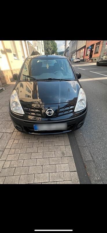 Schwarz Gebraucht 2008 Nissan Pixo Kleinwagen | 899 € - Bild 1/4