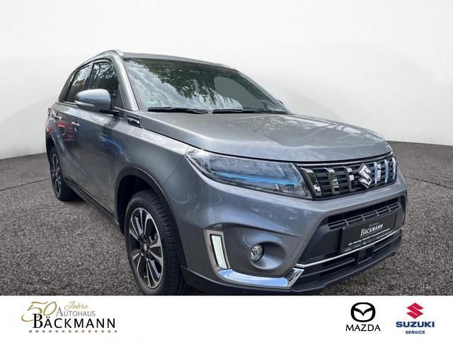 Grau Gebraucht 2022 Suzuki Vitara Comfort+ SUV | 22.950 € (Etwas zu teuer) - Bild 1/3