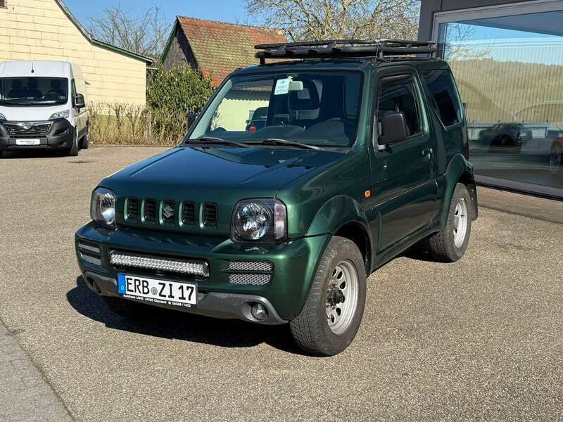 Grün Gebraucht 2011 Suzuki Jimny Comfort SUV | 8.900 € (Fairer Preis) - Bild 1/4