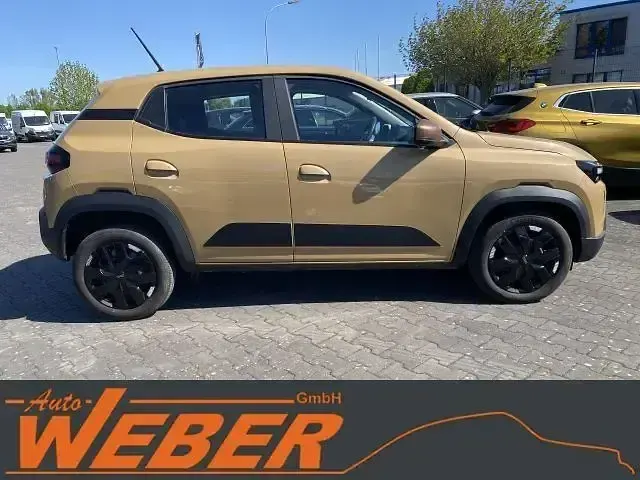 Gebraucht Dacia Spring Extreme 47 kW (65 PS) 2025 Beige Kleinwagen