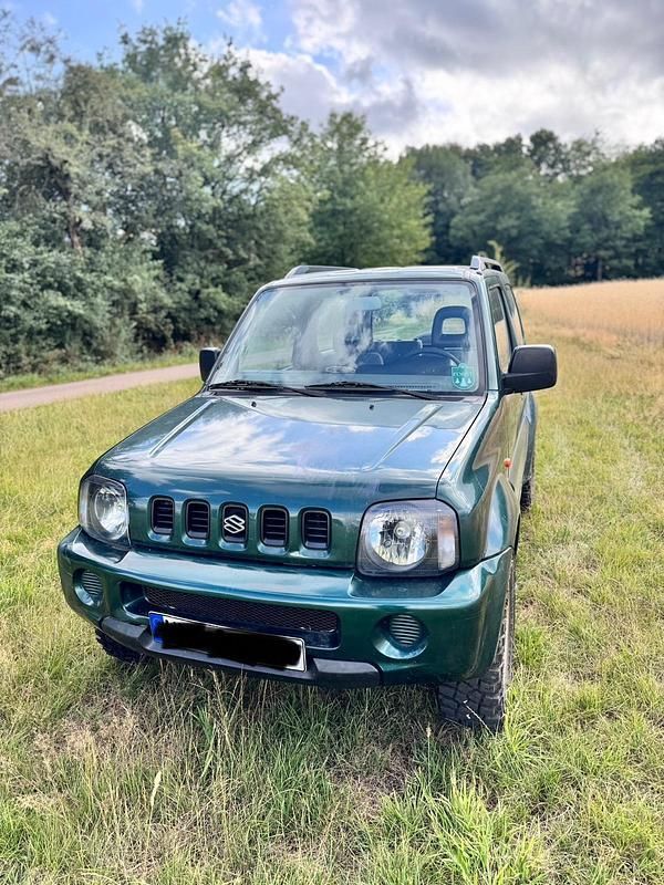 Grün Gebraucht 2002 Suzuki Jimny SUV | 5.950 € (Fairer Preis) - Bild 1/4