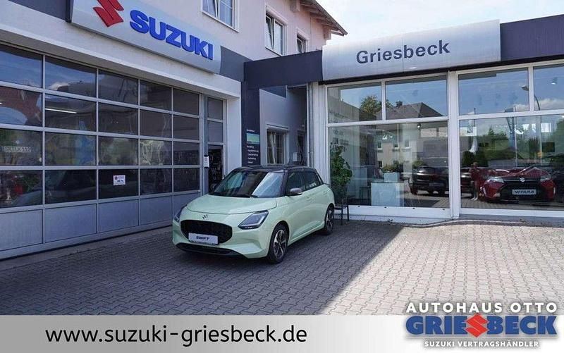 Cool yellow metallic Neu 2025 Suzuki Swift Comfort+ Kleinwagen | 21.737 € - Bild 1/4