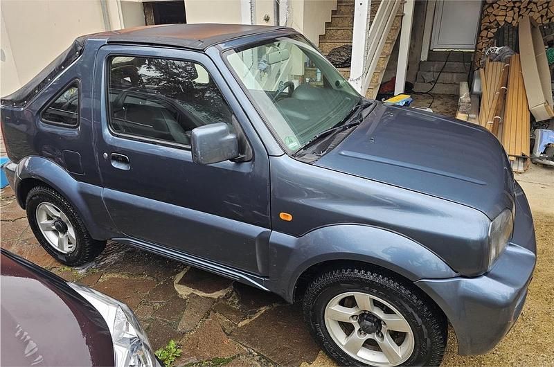 Grau Gebraucht 2009 Suzuki Jimny SUV | 7.590 € (Fairer Preis) - Bild 1/4