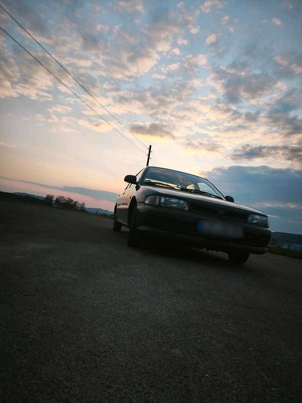 Second-hand Mitsubishi Lancer 75 CP (55 kW) 1995 Negru Berlinǎ