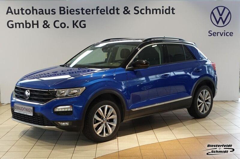 Ravennablau (metallic) Gebraucht 2021 VW T-Roc Style SUV | 23.790 € (Fairer Preis) - Bild 1/4