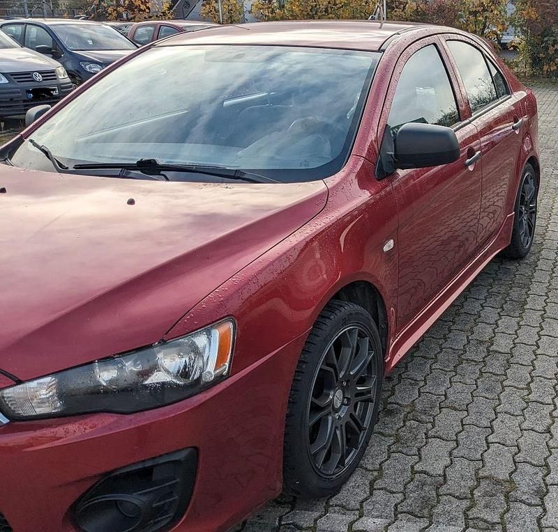 Gebraucht Mitsubishi Lancer 109 PS (80 kW) 2010 Rot Limousine