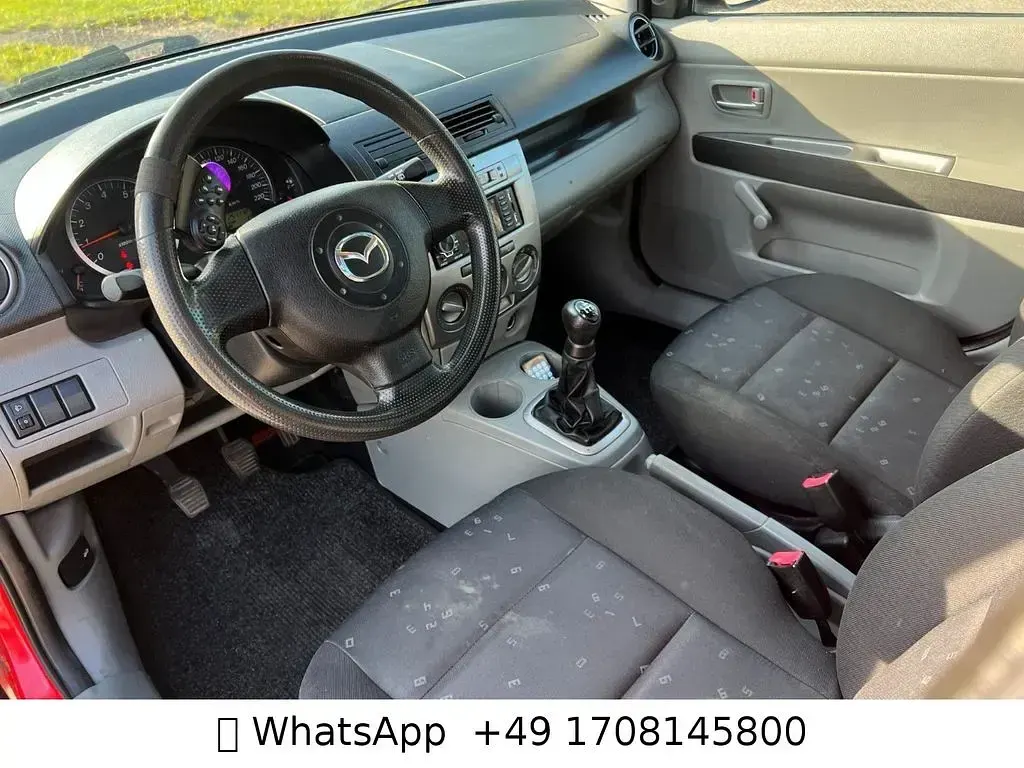 Używany Mazda 2 Comfort 75 KM (55 kW) 2004 Czerwony Hatchback