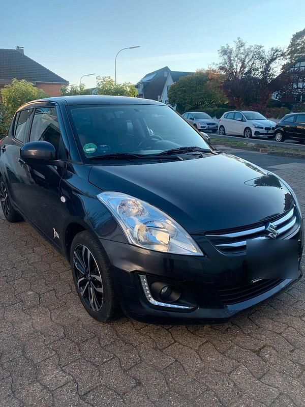 Grau Gebraucht 2015 Suzuki Swift Kleinwagen | 5.250 € - Bild 1/4