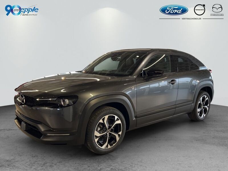 Machine grey Gebraucht 2024 Mazda MX30 Ad'Vantage SUV | 25.990 € (Guter Preis) - Bild 1/4