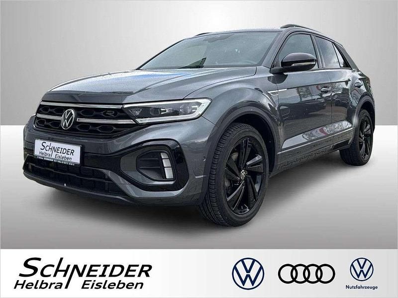 Indiumgrau (metallic) Gebraucht 2024 VW T-Roc R-line SUV | 33.560 € (Teuer) - Bild 1/4