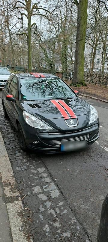 Gebraucht Peugeot 206 74 PS (54 kW) 2011 Schwarz Kleinwagen