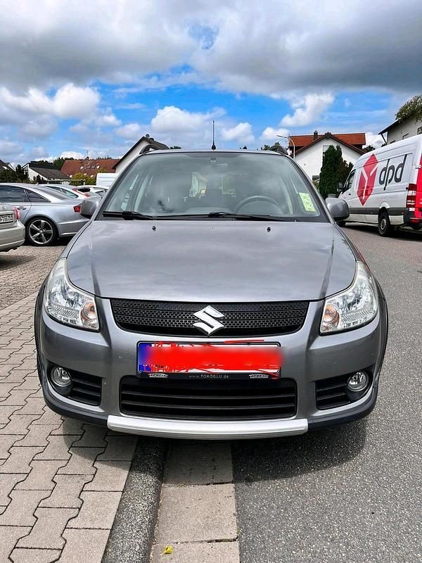 Grau Gebraucht 2009 Suzuki SX4 SUV | 6.400 € - Bild 1/4