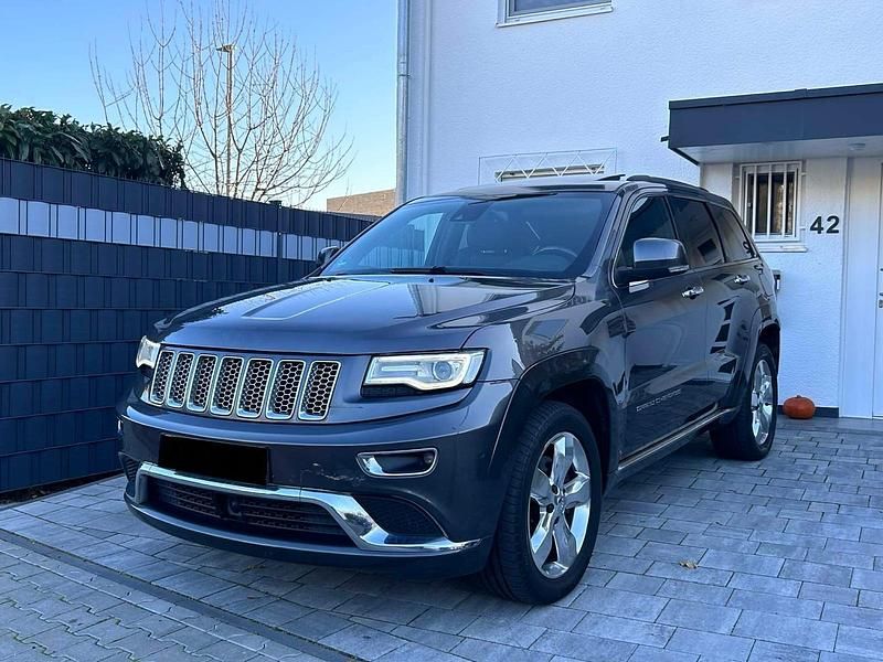Grau Gebraucht 2014 Jeep Grand Cherokee Summit SUV | 9.999 € (Fairer Preis) - Bild 1/4