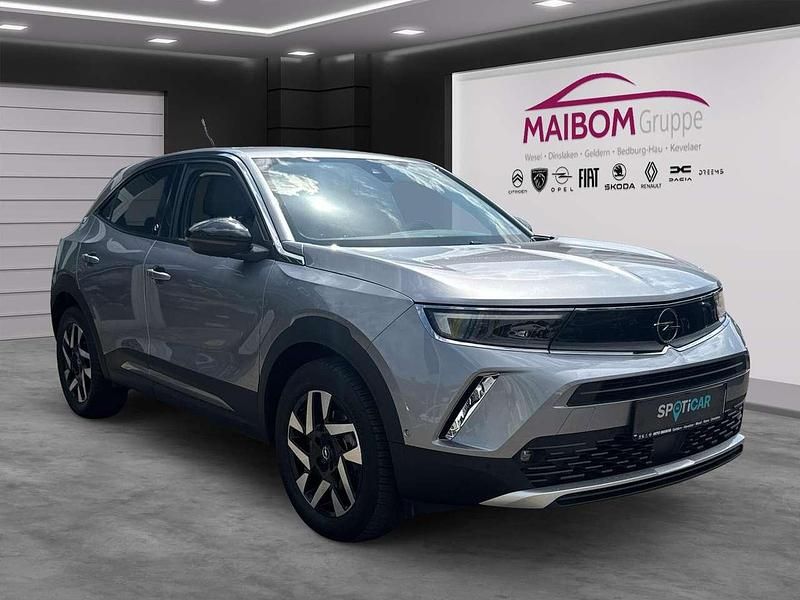 Gebraucht Opel Mokka-e Elegance 100 kW (136 PS) 2021 Kontrast grau/quarz silber SUV