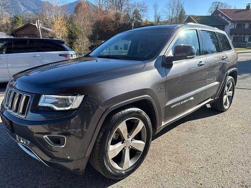 Grau Gebraucht 2015 Jeep Grand Cherokee Overland SUV | 16.999 € (Superpreis) - Bild 1/4