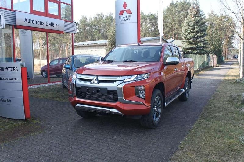 Zirkonorange Gebraucht 2022 Mitsubishi L200 Select Abholung | 32.990 € (Fairer Preis) - Bild 1/4