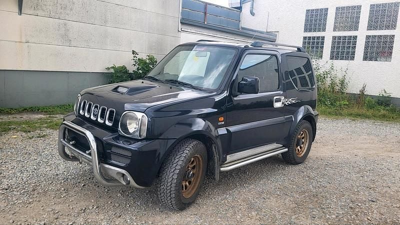 Schwarz Gebraucht 2005 Suzuki Jimny SUV | 4.590 € (Fairer Preis) - Bild 1/4