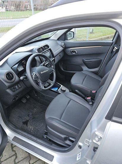 Gebraucht Dacia Spring Extreme 47 kW (65 PS) 2023 Diamantsilbergrau Kleinwagen
